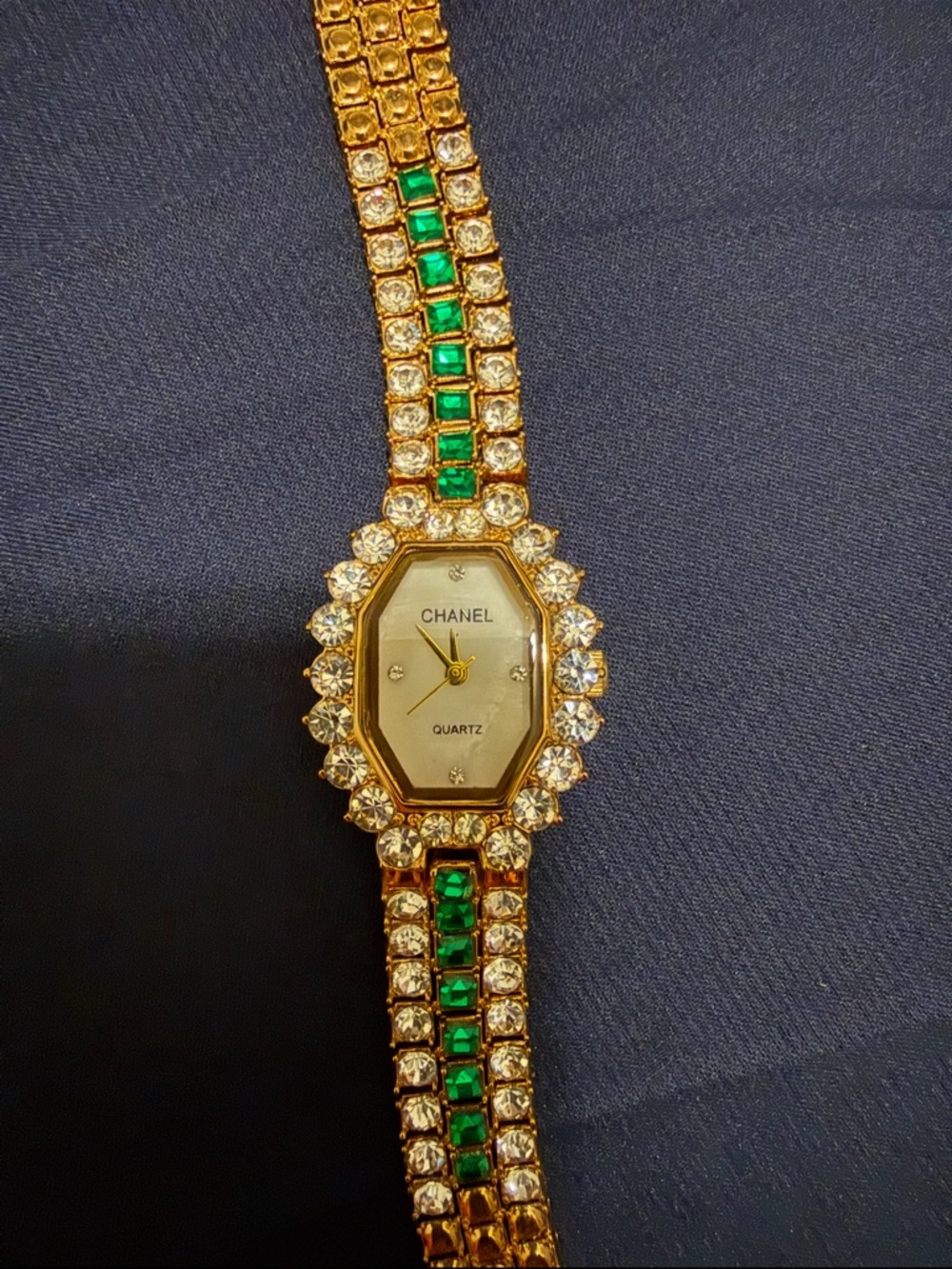 Gold Tone braclet watch with green & crystal stone